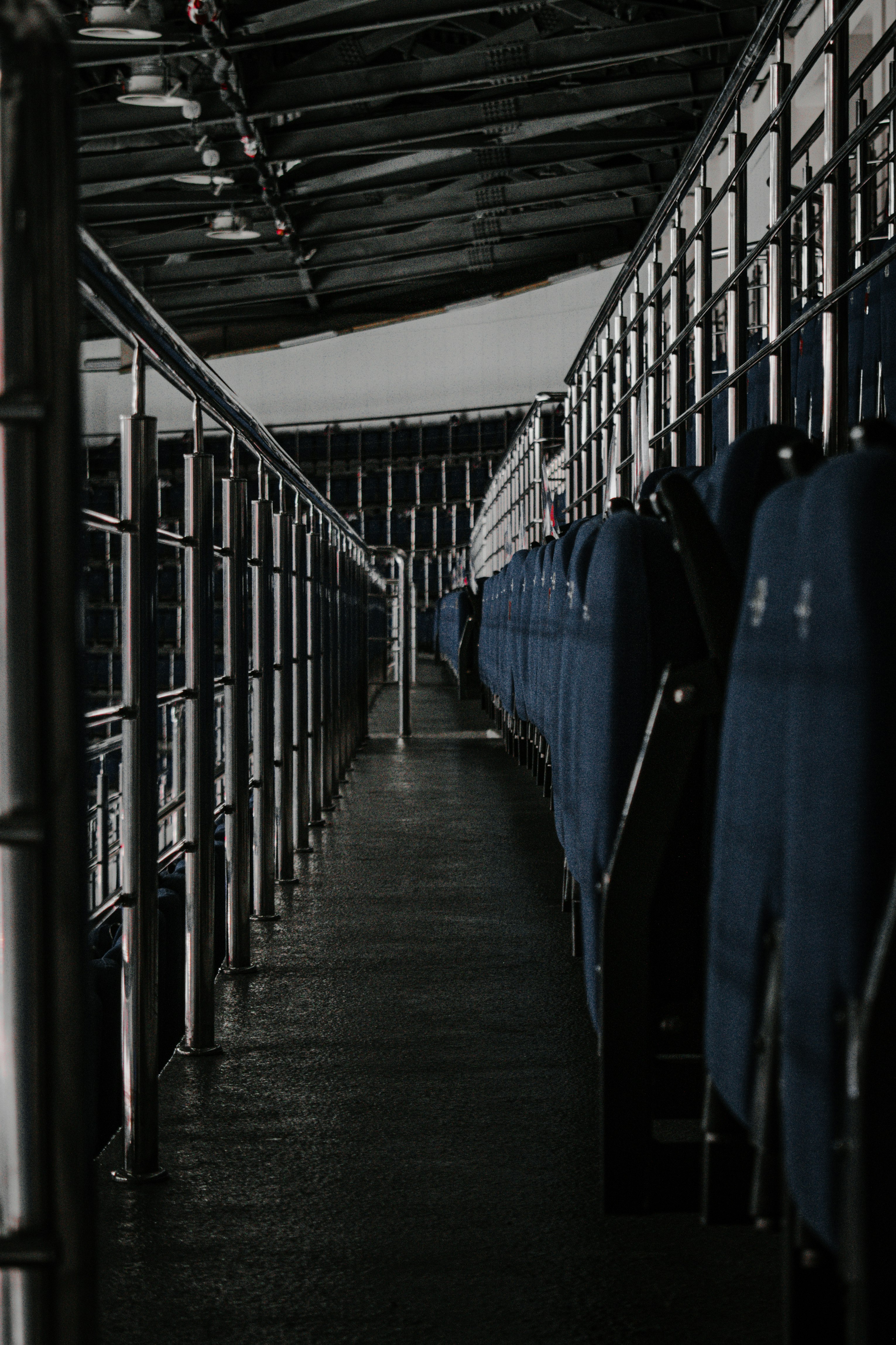 blue and black clothes on black steel rack